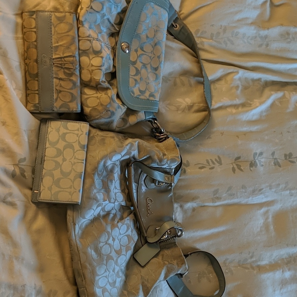 2 purses a wallet and a checkbook holder